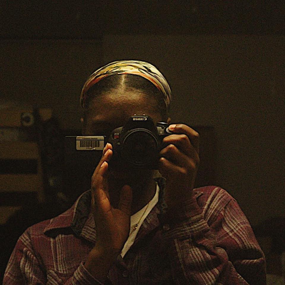 A photo of me taking a picture of my reflection in a mirror with a Canon camera